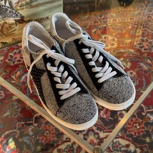 Lola Cruz silver metallic sneakers with a black raised star